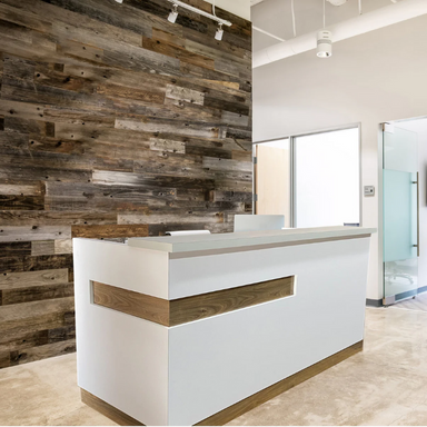 Reception Counter Solutions Maddox White Reception Desk Counter Modern Style Left Angle View Display White Counter with Light Brown Wood Detail Strip and Bottom Wood Border