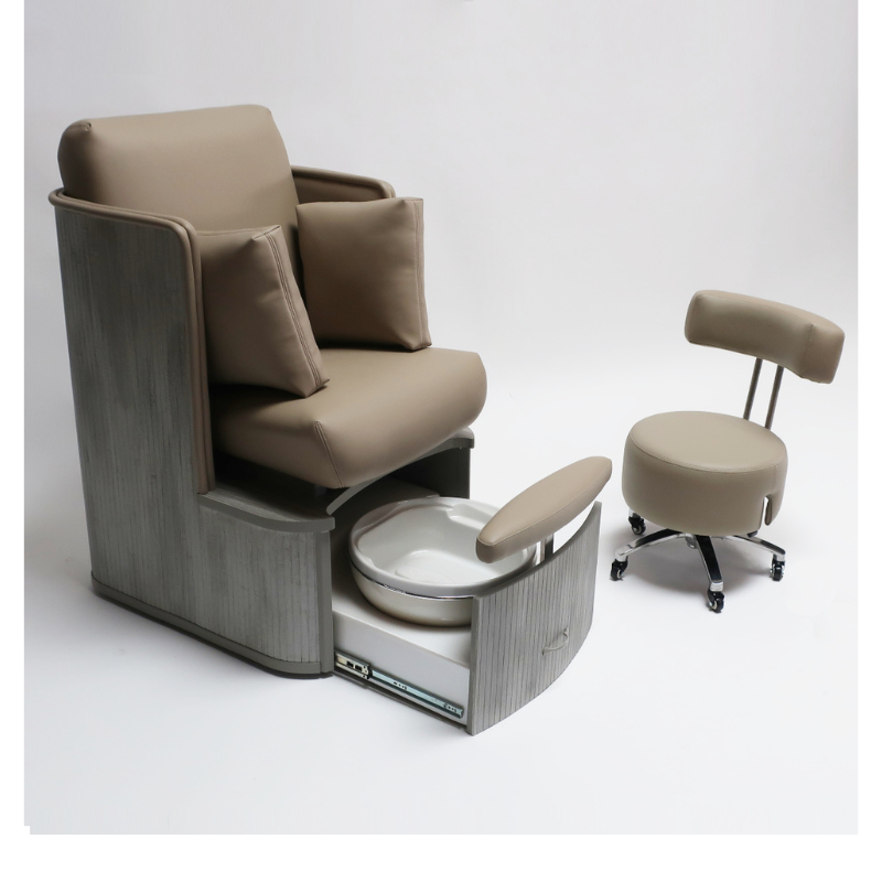 Belava Dorset Lounge Style Pedicure Chair With/Without Plumbing Tan Brown Color With Wood Finish Raised Platform Front View With Technician Basic Stool and Pillows