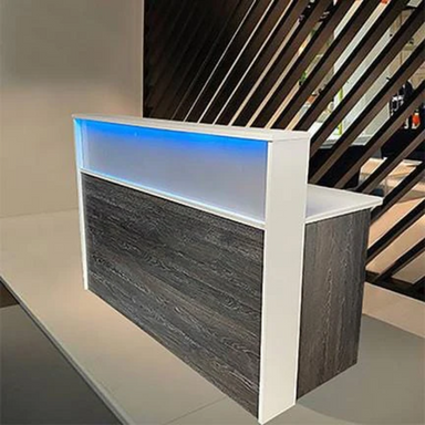 Reception Counter Solutions Frosted Malibu Reception Desk With Led Lights Front View Display in Scorched Oak Rustic Color 5 Feet Wide